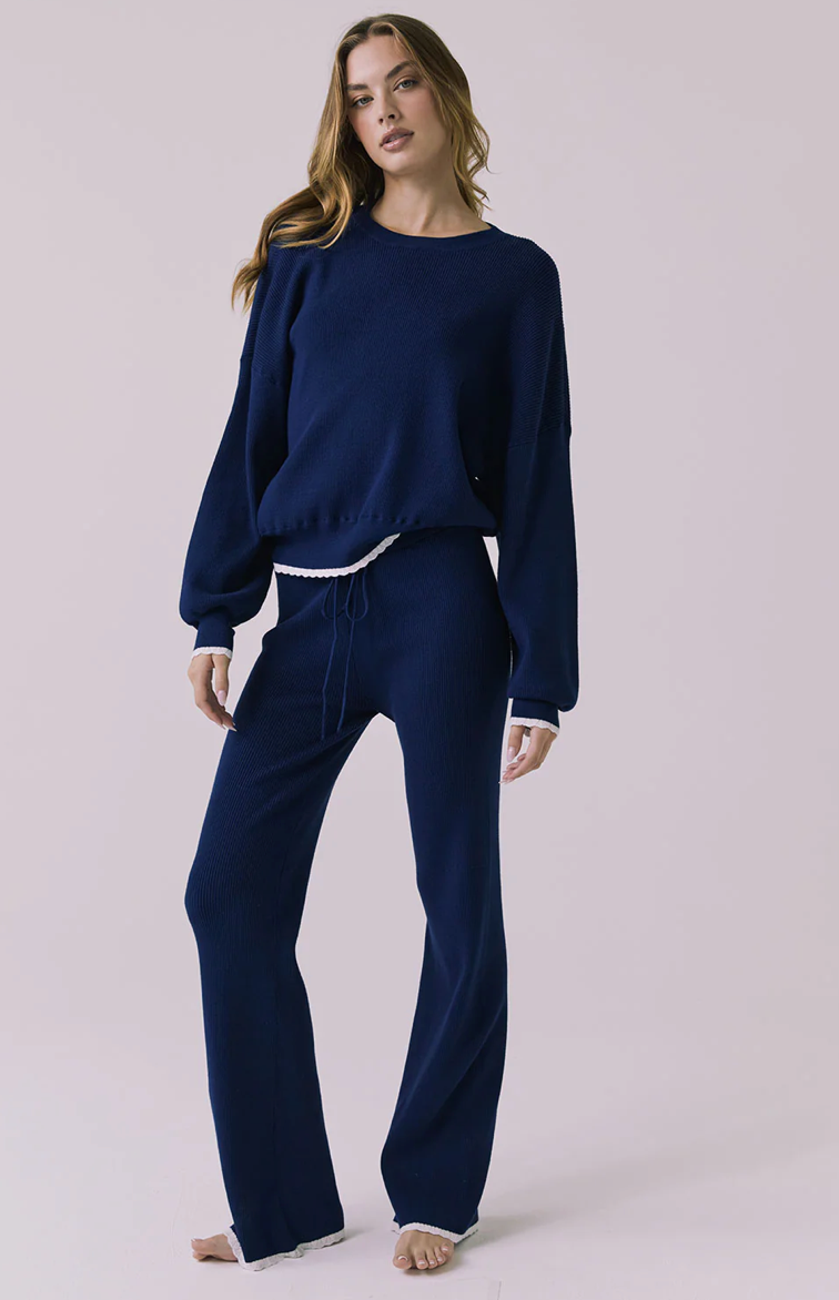 Rhode worn blue pullover